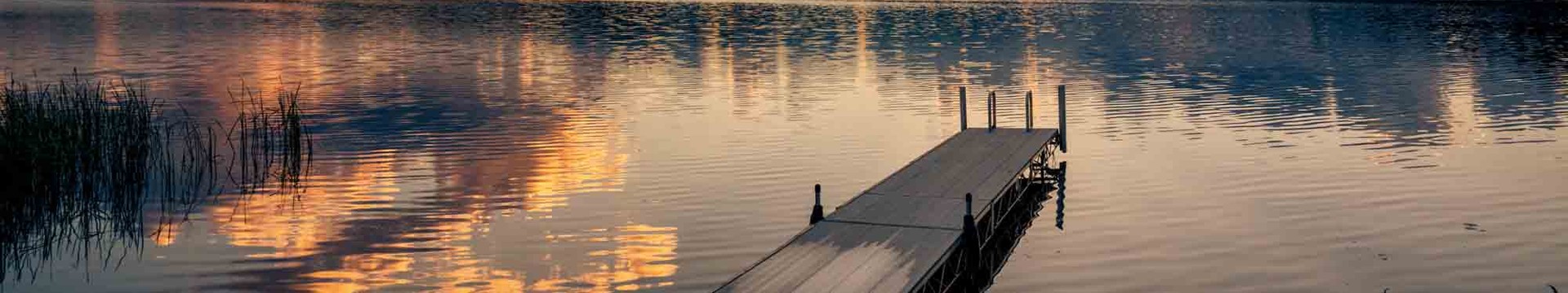 Sunset over a dock and lake