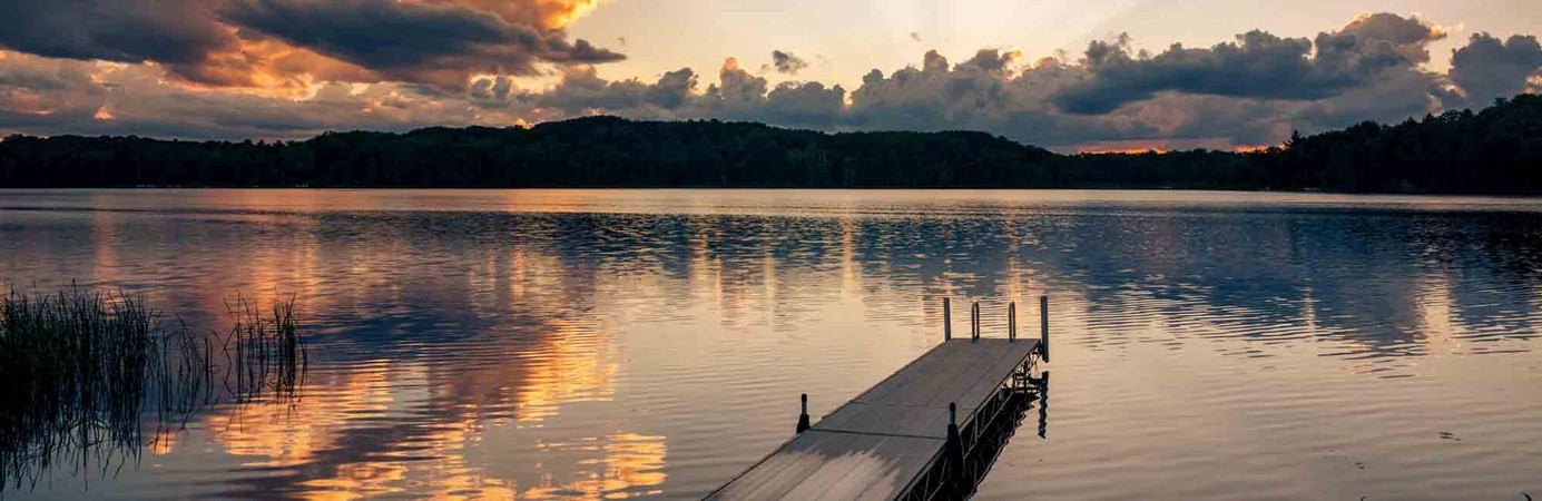 Sunset over a dock and lake