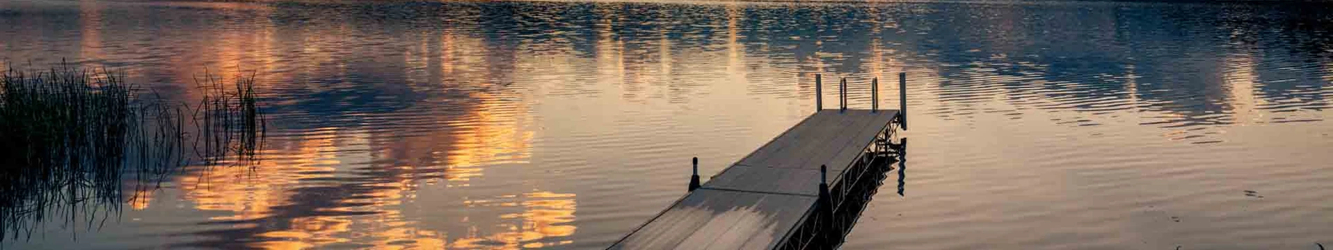 Sunset over a dock and lake