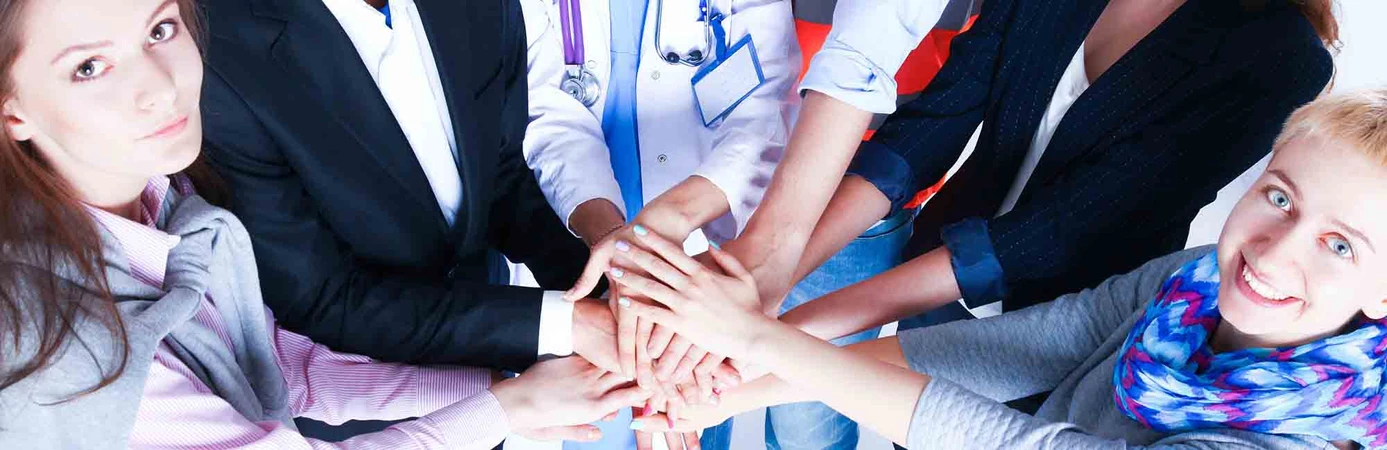 Coworkers standing together in a circle