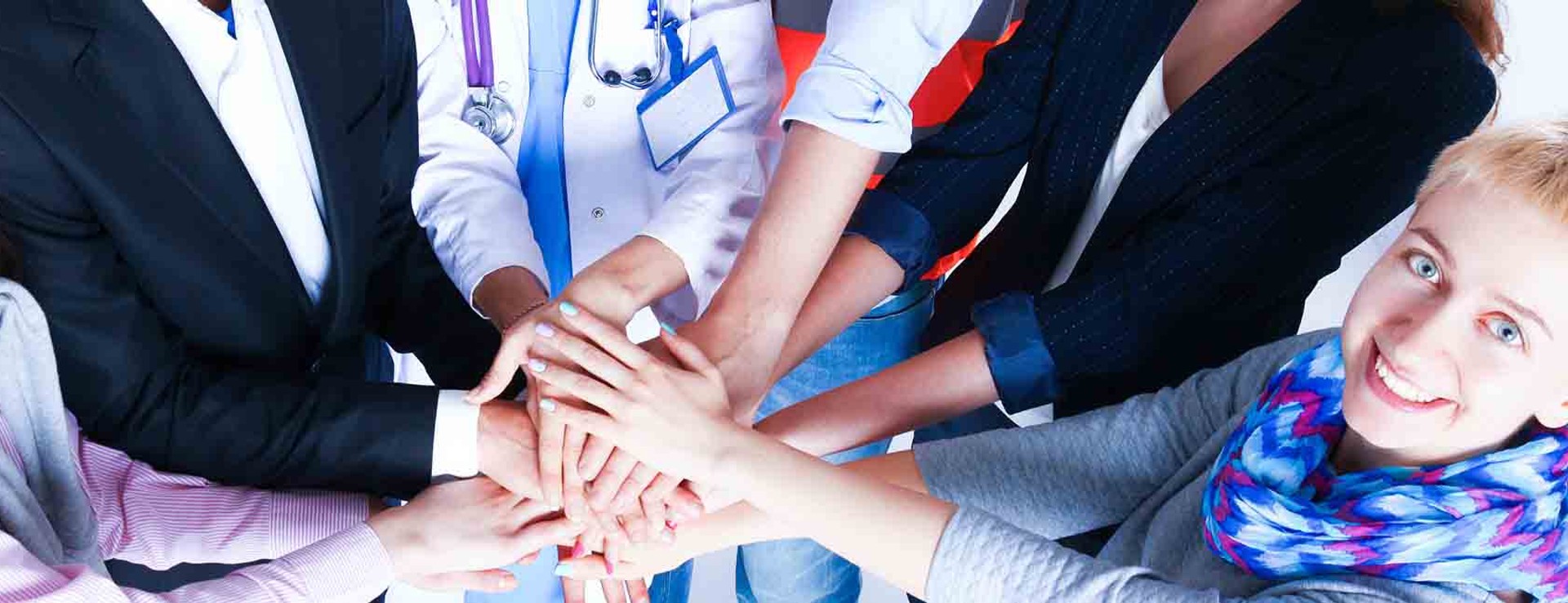 Coworkers standing together in a circle