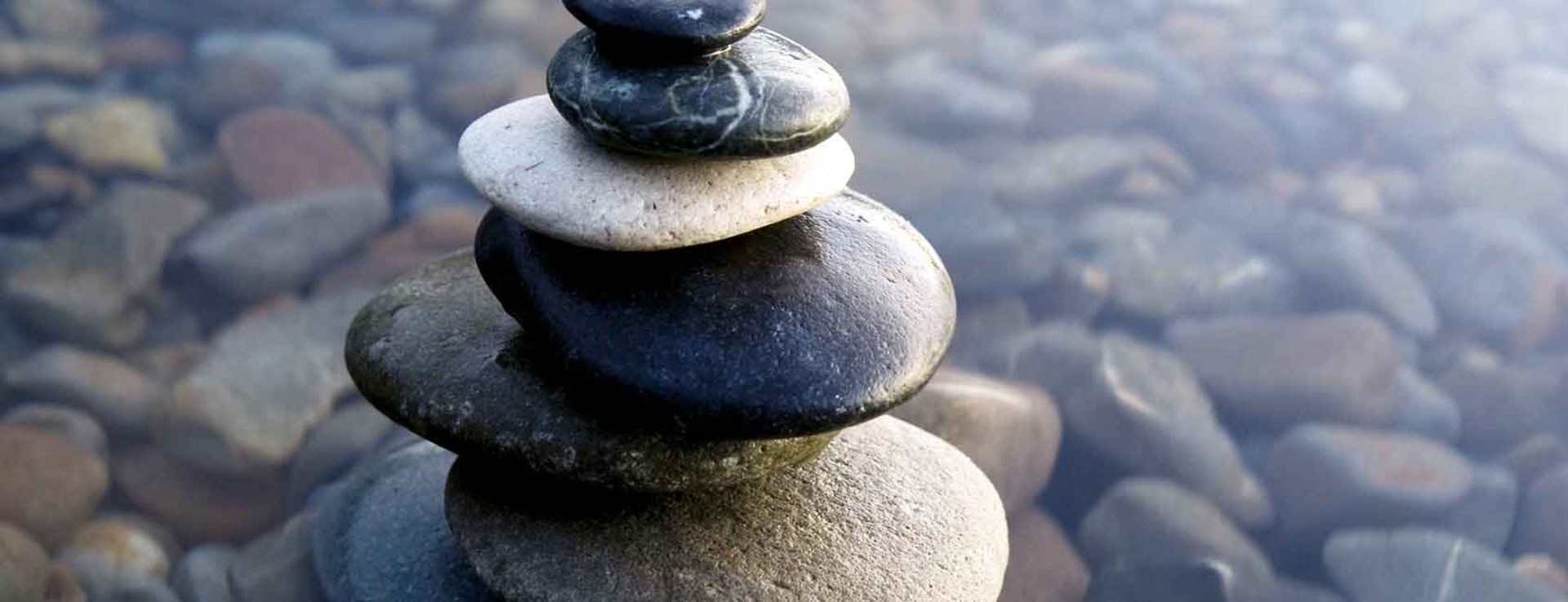 Zen rocks stack in shallow water