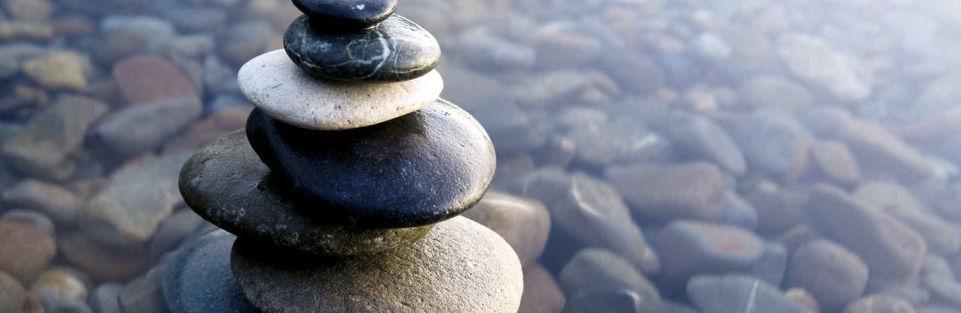 Zen rocks stack in shallow water
