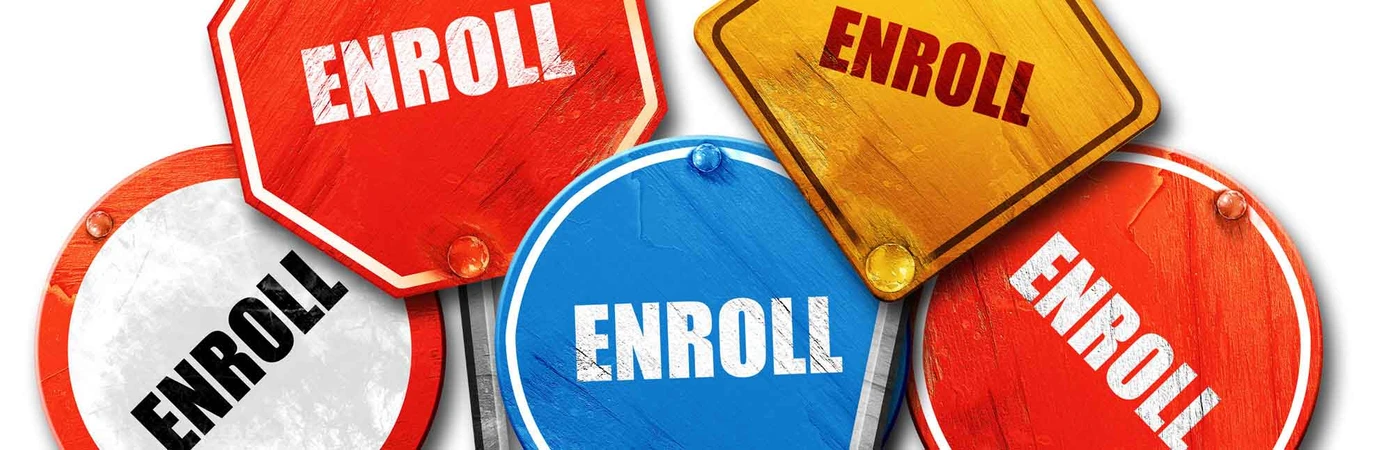 Street signs that say "enroll"